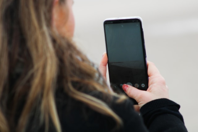 Young woman taking a photo
