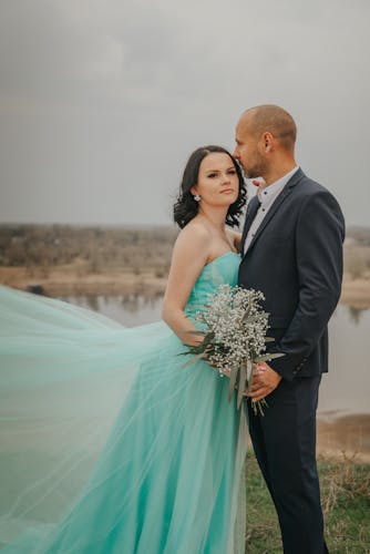 Bride and groom posing for wedding photo