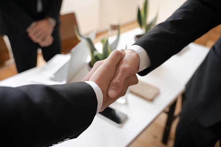 Two businesspeople shaking hands