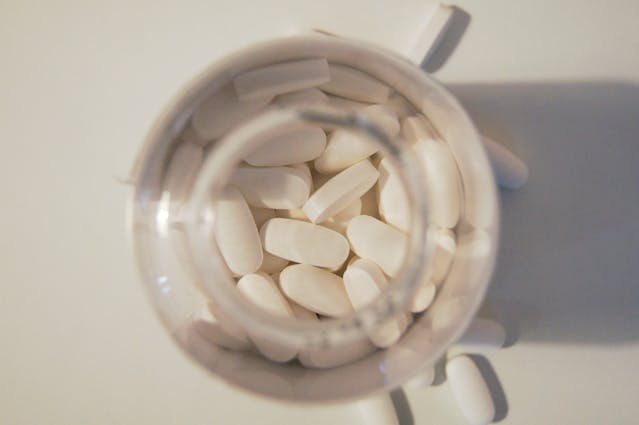 Jar filled with white tablets